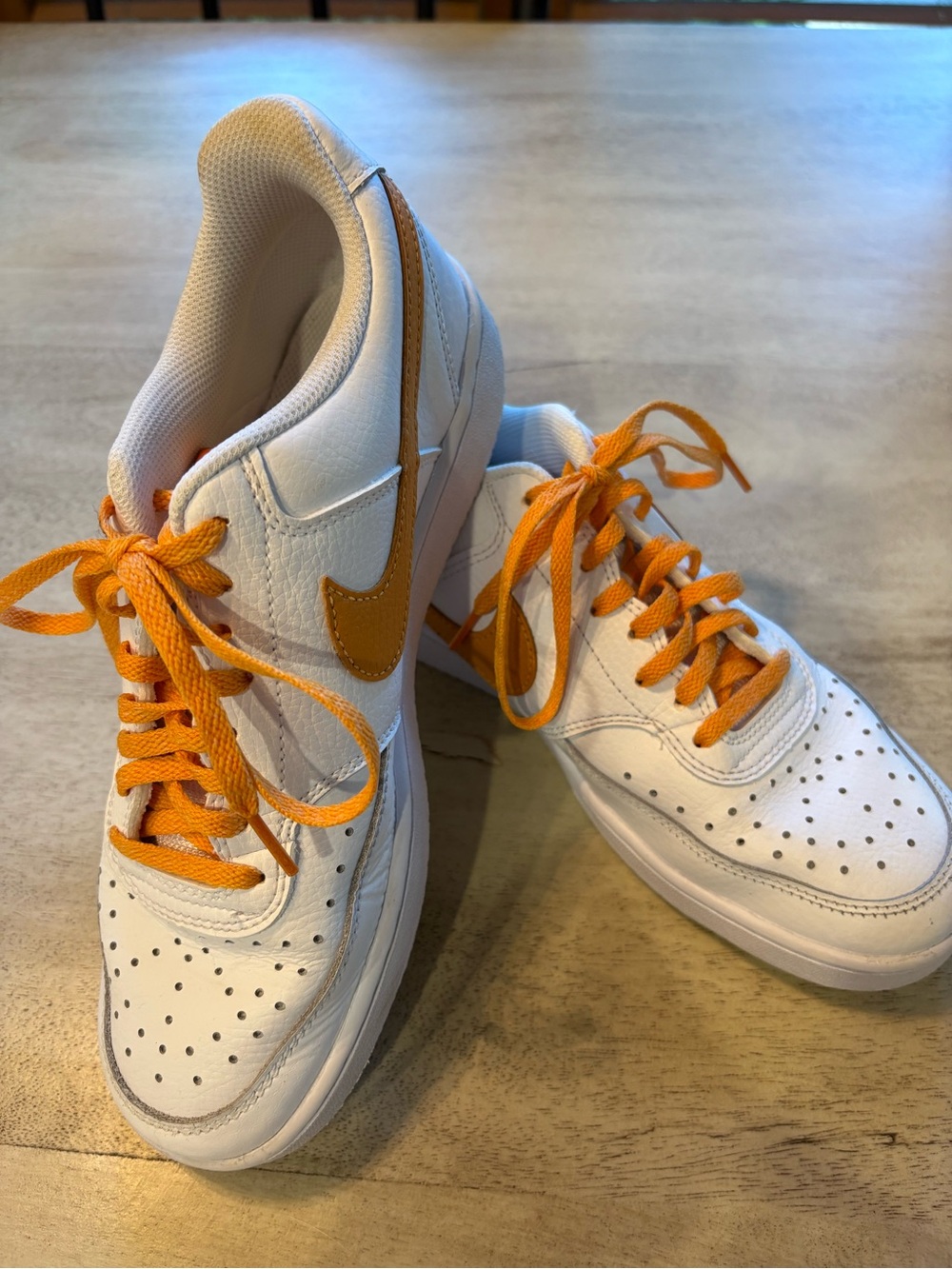 Nike White Sneakers with Orange Swoosh and Laces
